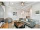 Stylish living room with comfortable seating, modern decor, and hardwood floors at 3607 W Roland St, Tampa, FL 33609