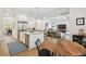 Open living space with a kitchen island, dining area, and view into the living room at 3607 W Roland St, Tampa, FL 33609