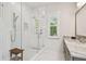 Modern main bathroom featuring a glass shower, sleek fixtures, and stylish tile design at 3607 W Roland St, Tampa, FL 33609