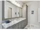 Stylish bathroom vanity with marble countertop, modern fixtures, and ample storage space at 3607 W Roland St, Tampa, FL 33609