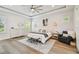 Spacious main bedroom with a tray ceiling, sitting area, and plenty of natural light at 3607 W Roland St, Tampa, FL 33609