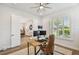 Home office featuring a wooden desk, two monitors, lots of natural light, and a comfortable chair at 3607 W Roland St, Tampa, FL 33609