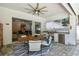 Covered patio with dining area and outdoor kitchen featuring modern stainless steel grill and outdoor refrigerator at 3607 W Roland St, Tampa, FL 33609