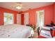 Bedroom with hardwood floors, ceiling fan, closet and connected bathroom at 413 Blackburn Rd, Nokomis, FL 34275