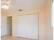 Bedroom with a closet and hardwood floors, with light neutral paint at 413 Blackburn Rd, Nokomis, FL 34275
