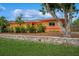 Cozy single-story home with mature trees and beautiful landscaping at 413 Blackburn Rd, Nokomis, FL 34275