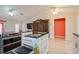 Spacious kitchen with stainless appliances, island with seating, and plenty of cabinet space at 413 Blackburn Rd, Nokomis, FL 34275