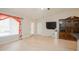 Well-lit, open living room with a sliding glass door and closet at 413 Blackburn Rd, Nokomis, FL 34275