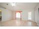 Bright, spacious living room with hardwood floors and neutral walls at 413 Blackburn Rd, Nokomis, FL 34275