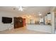 Open living room with hardwood floors next to the kitchen at 413 Blackburn Rd, Nokomis, FL 34275
