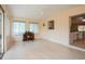 Sunroom boasts backyard access, light-filled ambiance, and seamless flow to the kitchen and living areas at 413 Blackburn Rd, Nokomis, FL 34275