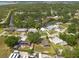 Overhead view capturing houses near the waterfront, lush greenery, and mature trees at 4507 26Th S Ave, Tampa, FL 33619
