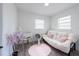Bright Bedroom featuring soft colors, a cozy futon, and a comfortable crib at 4507 26Th S Ave, Tampa, FL 33619