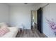 Minimalist bedroom design featuring clean lines and stylish wood flooring at 4507 26Th S Ave, Tampa, FL 33619