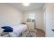 Bright bedroom with a twin bed, white dresser, and plush gray rug at 4507 26Th S Ave, Tampa, FL 33619
