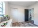Bright bedroom featuring a window and a view into the ensuite bathroom at 4507 26Th S Ave, Tampa, FL 33619