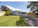 Charming single-story home featuring a cozy front porch and well-maintained lawn at 4507 26Th S Ave, Tampa, FL 33619