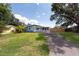 Inviting single-Gathering home with a porch, nestled among mature trees and lush landscaping at 4507 26Th S Ave, Tampa, FL 33619