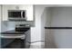Modern kitchen with stainless steel appliances and white cabinets at 4507 26Th S Ave, Tampa, FL 33619