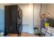 Efficient laundry room featuring a stacked washer/dryer and water heater at 4507 26Th S Ave, Tampa, FL 33619