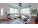 Bright living room featuring new flooring, neutral decor, and ample natural light at 4507 26Th S Ave, Tampa, FL 33619