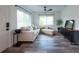 Bright living room featuring new flooring, neutral decor, and ample natural light at 4507 26Th S Ave, Tampa, FL 33619
