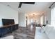 Open-concept living room with modern furnishings and lots of natural light at 4507 26Th S Ave, Tampa, FL 33619