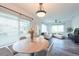 Open-concept living and dining area with modern furnishings and lots of natural light at 4507 26Th S Ave, Tampa, FL 33619