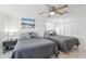 Cozy bedroom with two twin beds, nautical decor, and tile floors at 4902 Blue Heron Dr, New Port Richey, FL 34652