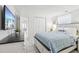 Comfortable bedroom featuring a queen-sized bed, ample closet space, and a bright window at 4902 Blue Heron Dr, New Port Richey, FL 34652