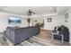 Spacious living room features hardwood floors, and tray ceiling at 4902 Blue Heron Dr, New Port Richey, FL 34652