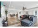 Inviting living room featuring hardwood floors, open layout to kitchen and dining area at 4902 Blue Heron Dr, New Port Richey, FL 34652