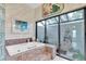 Inviting bathroom with a soaking tub and a view to the outside at 4973 60Th S Ave, St Petersburg, FL 33715