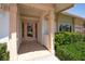 Inviting front entrance with decorative glass door and manicured landscaping at 4973 60Th S Ave, St Petersburg, FL 33715