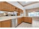 Spacious kitchen with stainless steel dishwasher, ample cabinet, and counter space at 4973 60Th S Ave, St Petersburg, FL 33715