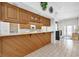 Kitchen with wood paneled breakfast bar and tiled flooring at 4973 60Th S Ave, St Petersburg, FL 33715