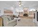 Spacious living room with fireplace and built-in bookshelves at 4973 60Th S Ave, St Petersburg, FL 33715