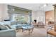 Bright living room featuring comfortable seating, a glass table, and ample natural light at 4973 60Th S Ave, St Petersburg, FL 33715