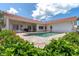 Inviting pool area surrounded by lush greenery and a spacious patio perfect for relaxation at 4973 60Th S Ave, St Petersburg, FL 33715
