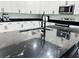 Beautiful kitchen with white cabinets, black countertop, stainless steel appliances and island at 5180 69Th N Ave, Pinellas Park, FL 33781
