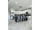 Contemporary kitchen equipped with a large island, sleek cabinetry, and an open layout perfect for entertaining at 5180 69Th N Ave, Pinellas Park, FL 33781