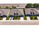 Aerial view of newly built modern homes with two-car garages and landscaping, near a busy road and convenient location at 5814 Stockport St, Riverview, FL 33578