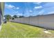 Well-maintained backyard with lush green grass and a tall privacy fence at 5814 Stockport St, Riverview, FL 33578