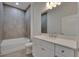 Bathroom with gray tile surround and a white vanity with drawers at 5814 Stockport St, Riverview, FL 33578