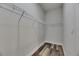 Walk-in closet featuring wire shelving and stylish multi-tone wood-look flooring at 5814 Stockport St, Riverview, FL 33578