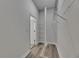 Walk-in closet featuring wire shelving and stylish multi-tone wood-look flooring at 5814 Stockport St, Riverview, FL 33578