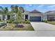 Attractive single-Gathering home with a two-car garage, tidy landscaping, and a concrete driveway at 5814 Stockport St, Riverview, FL 33578