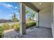 Charming covered front porch with brick pavers and mature landscaping at 5814 Stockport St, Riverview, FL 33578