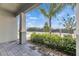 Inviting front porch featuring lush landscaping and shaded comfort at 5814 Stockport St, Riverview, FL 33578