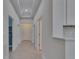Hallway with tile floors and a tray ceiling at 5814 Stockport St, Riverview, FL 33578